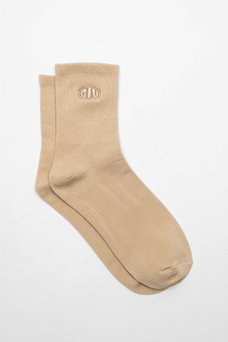 Beige sock with a logo in matching color