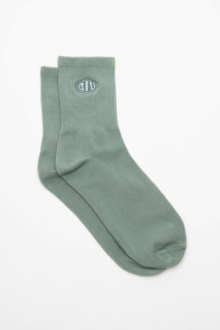 Green sock with a logo in green 